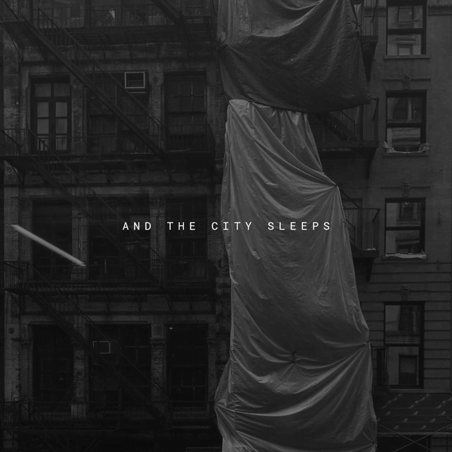 And The City Sleeps cover art. A dull, gray, city building. Under construction.
